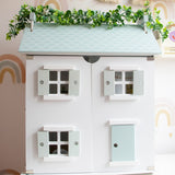 Barnshenn wooden dolls house featuring intricate details, perfect for fostering imaginative play and creativity in children