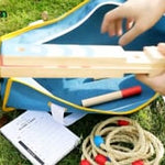 Bring the fun of the fairground to your garden with the Barnshenn Ring Toss Game. Whether you're planning a birthday party or you're looking forward to lots of fun with Mum and Dad, this Ring Hook Game is perfect for sunny days spent in the garden. A durable toy with a sturdy base and strong pegs, the wooden Quoits set has attractive rings that can be easily grasped by tiny hands. Our eco-friendly, wooden Quoits set is suitable for both indoor and outdoor merriment and will be enjoyed by kids of different a