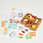 View of all elements of the wooden shop, made with wood and suitable for children aged three and above. The shop toy promotes role-play in kids.